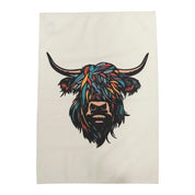 A white cotton tea towel featuring a vibrantly illustrated Highland cow head in multiple bold colors.